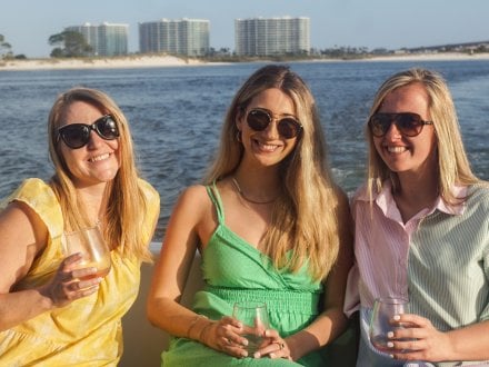 Friends on a private sunset cruise in Orange Beach