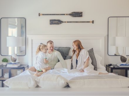 Family relaxing in vacation rental at Beach Village Resort in Orange Beach