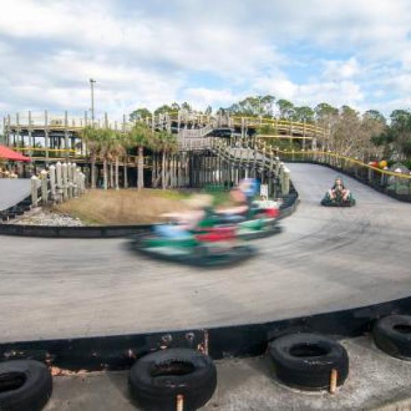 go-karts zipping around the course at The Track Family Fun Park in Gulf Shores