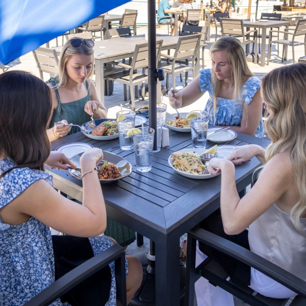 girlfriends dining at zeke's waterfront restaurant in Orange Beach