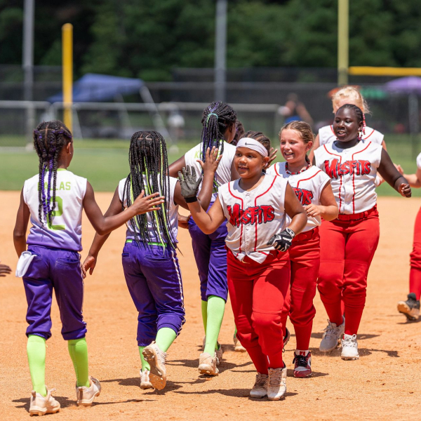 USSSA Softball teams high fiving after a tournament in Orange Beach