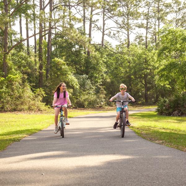 Children biking on Alabama's Beaches