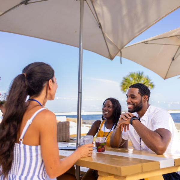 Meeting attendees enjoying a drink at The Gulf restaurant on Alabama's Beaches
