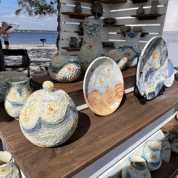 locally-made pottery at an arts and crafts booth at ballyhoo festival in gulf state park