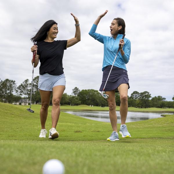Girls golfing at Craft Farms