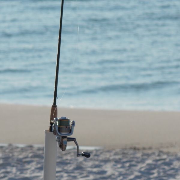 Rod set up on beach for surf fishing in Orange Beach