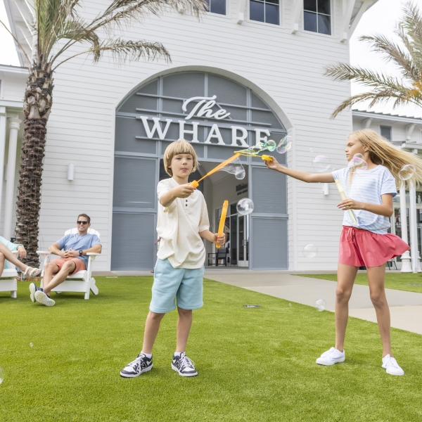 Kids playing with bubbles at The Wharf