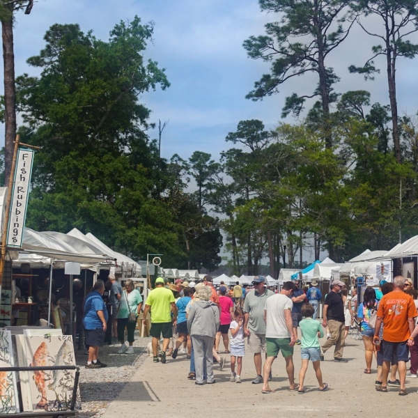 Crowd of people and booths at the Orange Beach Festival of Arts