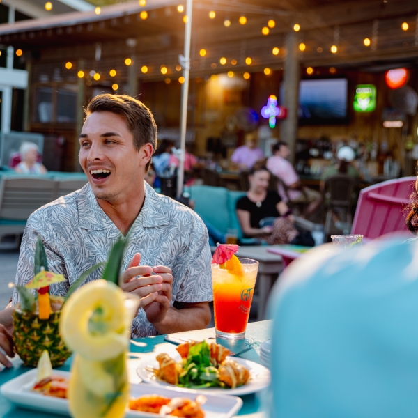 Friends eating at GT's during their spring getaway to Alabama's Beaches