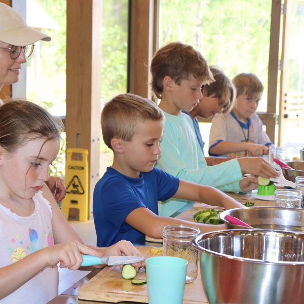 Children learning to make pickles a the Eco Center during a summer camp on Alabama's Beaches