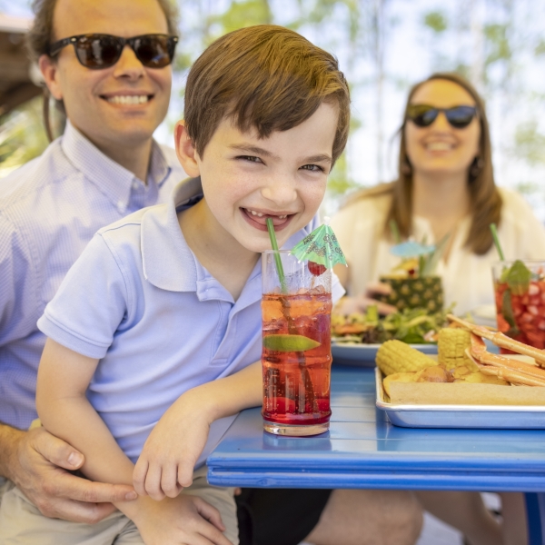 Family enjoying a meal at GT's on the Bay