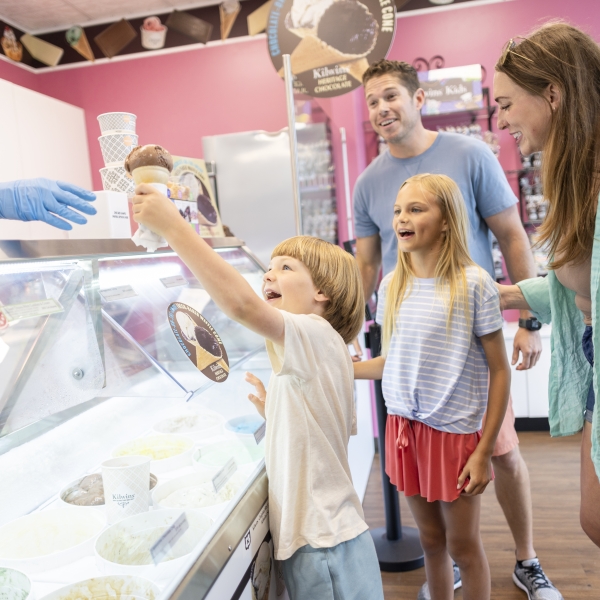 A family getting ice cream at a local ice cream parlor