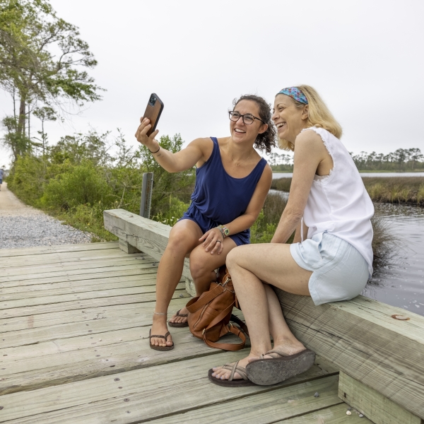 Friends walking on the Pine Beach Trail in Bon Secour