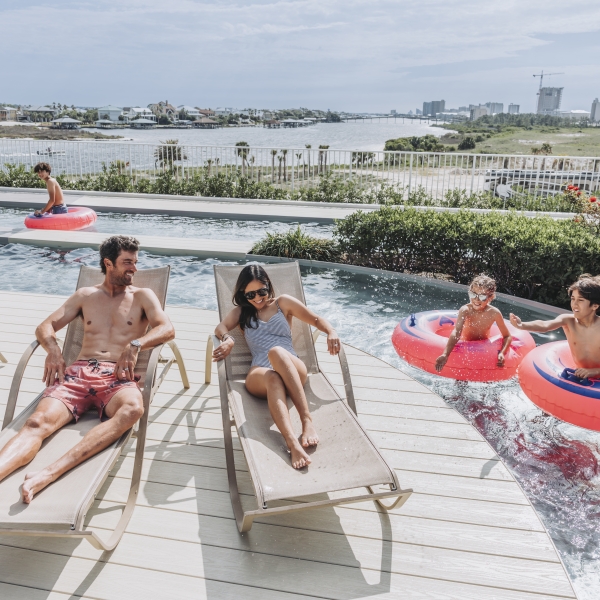 A family enjoying their pool at the Caribe.