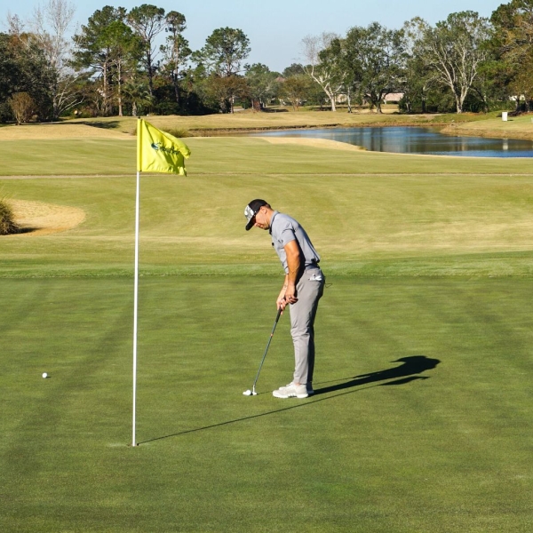 Man golfing at Craft Farms golf course in Gulf Shores