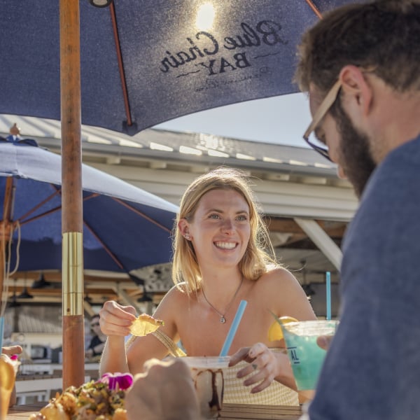 Couple enjoying a meal together at Coastal Restaurant