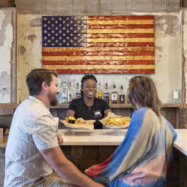 Couple enjoying BBQ at Hog Wild