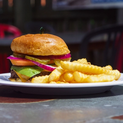 a big, juicy burger and fries at The Cove, local dive bar in Gulf Shores