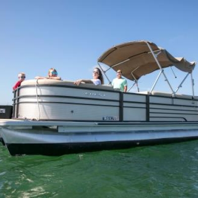 family cruising around the islands of Orange Beach in a pontoon boat rental