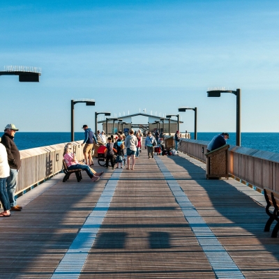 Sightseers and anglers along the Gulf State Park Fishing Pier in Gulf Shores