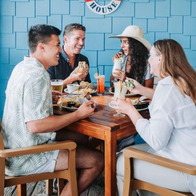 friends dining at beach house kitchen and cocktails seafood restaurant in gulf shores