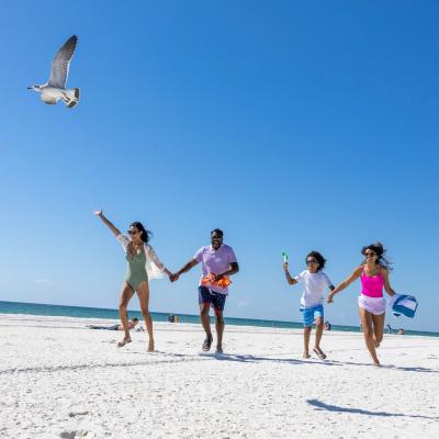 family running on the beach in gulf shores