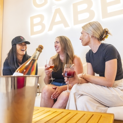 Friends enjoying a drink at Gulf Babe Wine Boutique at The Wharf