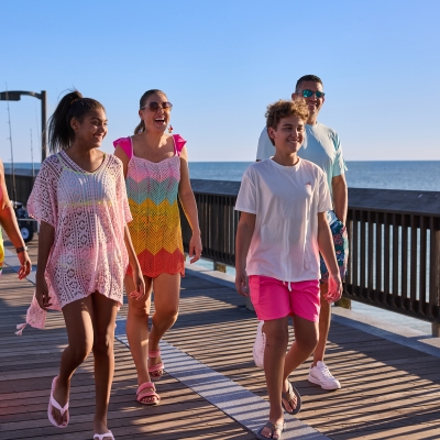 Family walking on the pier