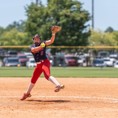 Pitcher winding up a throw at a softball game in Gulf Shores