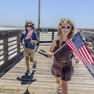 Kids on the pier with American Flags