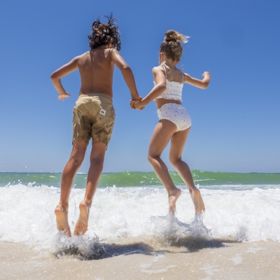 kids jumping into the water
