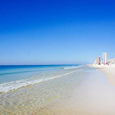 Clear waters and white sand on the beach at Gulf Shores