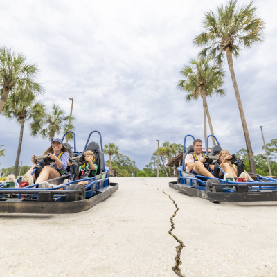 Family racing go-karts at The Track family-friendly attraction in Gulf Shores