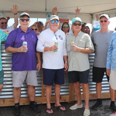 A group of guy friends enjoying Shrimp Fest on Alabama's Beaches