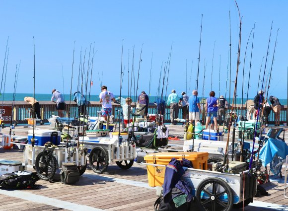 Anglers fishing at the end of the Gulf State Park Fishing Pier in Gulf Shores