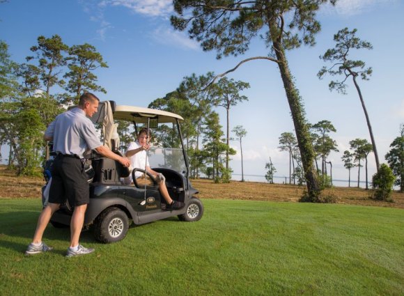 Father son golfing on Alabama's Beaches