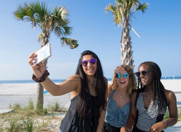 teens taking selfies in gulf shores