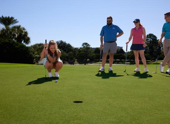 Group golfing at Kiva Dunes