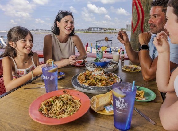 A family enjoying a meal on Alabama's Beaches