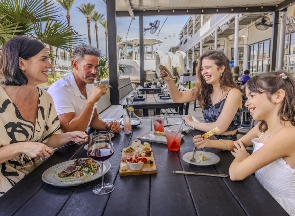 Family having dinner at Villigaio's at The Wharf in Orange Beach