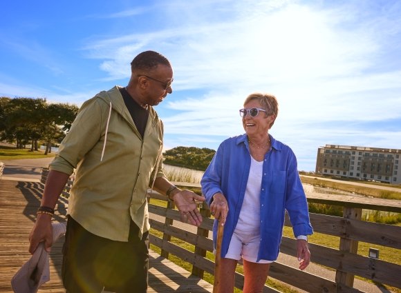 Friends walking in Gulf State Park during the spring