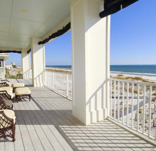 Gulf view from a vacation rental balcony in Fort Morgan, Alabama, overlooking white sandy beaches