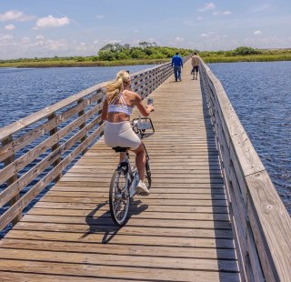 Person riding a bike through the Gulf State Park