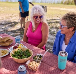 Girlfriend's enjoying a meal during their spring trip to Alabama's Beaches