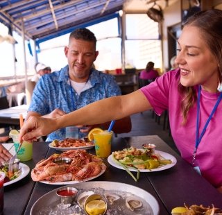 Family enjoying a meal together at Sea-n-Suds