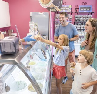 Family enjoying ice cream on Alabama's Beaches