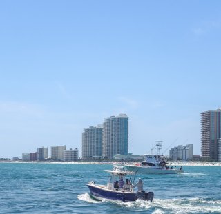 Boat cruising the waters surrounding Alabama's Beaches