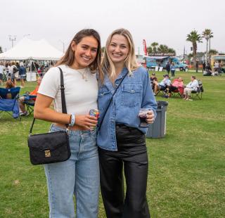Friends attending the Annual Coastal Alabama Food Truck & Craft Beer Festival in Gulf Shores