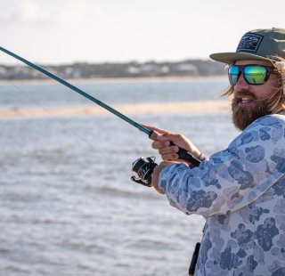 Man fishing during the fall on Alabama's Beaches