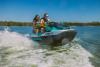 Couple riding a Jet Ski along the back bays of Orange Beach